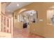 Inviting living room featuring terra cotta tile flooring and an archway to another room at 9137 E Odessa St, Mesa, AZ 85207