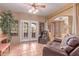 Bright living room with ceiling fan, terra cotta tile, and comfortable leather furniture at 9137 E Odessa St, Mesa, AZ 85207