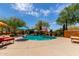 Lounge and relax in the outdoor pool area with desert landscaping and ample patio space at 9137 E Odessa St, Mesa, AZ 85207