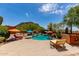 Lounge and relax in the outdoor pool area with desert landscaping and ample patio space at 9137 E Odessa St, Mesa, AZ 85207
