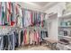 Organized walk-in closet with shelves and hanging rods for ample storage at 9137 E Odessa St, Mesa, AZ 85207