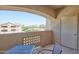 Relaxing covered balcony featuring a table, chair, and views of the surrounding neighborhood at 920 E Devonshire Ave # 4021, Phoenix, AZ 85014