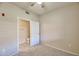 This bedroom features a ceiling fan and ensuite bathroom for convenience and privacy at 920 E Devonshire Ave # 4021, Phoenix, AZ 85014