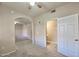 Cozy bedroom boasts neutral tones, ceiling fan, and convenient access to an ensuite bathroom at 920 E Devonshire Ave # 4021, Phoenix, AZ 85014