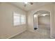 This bedroom features a window with plantation shutters for controlling light and privacy at 920 E Devonshire Ave # 4021, Phoenix, AZ 85014