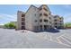 Multi-story apartment complex exterior with parking and easy access to community amenities at 920 E Devonshire Ave # 4021, Phoenix, AZ 85014