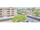 Exterior view of a multi-story building with covered parking and mature landscaping at 920 E Devonshire Ave # 4021, Phoenix, AZ 85014