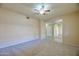 Spacious living room with neutral carpeting, ceiling fan, and arched entryway at 920 E Devonshire Ave # 4021, Phoenix, AZ 85014
