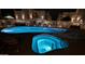 Inviting pool and spa area illuminated at night at 920 E Devonshire Ave # 4021, Phoenix, AZ 85014