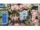 Overhead shot of a pool, tennis court and condo roofs of the community at 9705 E Mountain View Rd # 1050, Scottsdale, AZ 85258