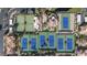 Overhead view highlighting the tennis courts, landscaping and building of the community at 9705 E Mountain View Rd # 1050, Scottsdale, AZ 85258