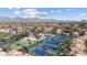 Aerial view showcasing a community, mountain views and tennis courts at 9705 E Mountain View Rd # 1050, Scottsdale, AZ 85258