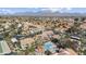 Expansive aerial view showcases community with pool, lush landscaping, and stunning mountain backdrop at 9705 E Mountain View Rd # 1050, Scottsdale, AZ 85258