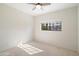 Bright bedroom with neutral carpet, a ceiling fan and a window letting in natural light at 9705 E Mountain View Rd # 1050, Scottsdale, AZ 85258