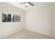 Neutral bedroom with carpet, one window, and a ceiling fan at 9705 E Mountain View Rd # 1050, Scottsdale, AZ 85258