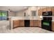 Well-equipped kitchen features tile countertops, appliances, and opens to the living area at 9750 N Monterey Dr # 21, Fountain Hills, AZ 85268