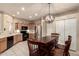 Cozy kitchen with tile flooring, stainless steel appliances, and a dining area with a pendant light at 9750 N Monterey Dr # 21, Fountain Hills, AZ 85268