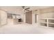 Bright living room showing the open floor plan, built-in shelving, and adjacent dining area at 9750 N Monterey Dr # 21, Fountain Hills, AZ 85268