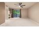 Spacious main bedroom with a ceiling fan and sliding glass doors leading to an outdoor patio at 9750 N Monterey Dr # 21, Fountain Hills, AZ 85268