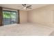 Bright main bedroom with sliding glass doors leading to the patio and neutral carpet at 9750 N Monterey Dr # 21, Fountain Hills, AZ 85268
