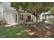 Spacious backyard with artificial grass and a covered patio perfect for outdoor entertaining and relaxing at 11021 N 64Th Ln, Glendale, AZ 85304
