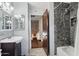 Bathroom featuring walk-in shower, modern fixtures and tiled floors at 11021 N 64Th Ln, Glendale, AZ 85304