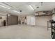 Spacious garage with ample storage cabinets, epoxy flooring, and a clean, organized layout at 11021 N 64Th Ln, Glendale, AZ 85304