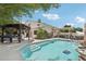 Backyard pool with adjacent pergola and comfortable seating, perfect for outdoor living and entertaining at 11021 N 64Th Ln, Glendale, AZ 85304