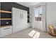This bedroom offers a built-in Murphy bed, with ample shelving and a modern design at 11705 W Luxton Ln, Avondale, AZ 85323