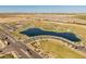 Aerial view of the community lake and park, highlighting recreational opportunities at 11705 W Luxton Ln, Avondale, AZ 85323