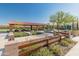 View of the community ramada with seating and barbecue facilities in a landscaped park at 11705 W Luxton Ln, Avondale, AZ 85323