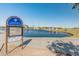 Community fishing pond with community fishing water sign at 11705 W Luxton Ln, Avondale, AZ 85323
