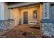 Charming front porch featuring a cozy swing and stylish decor that adds curb appeal to the home at 11705 W Luxton Ln, Avondale, AZ 85323