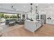 Spacious living area seamlessly blending the kitchen, dining, and living spaces for modern living and entertaining at 11705 W Luxton Ln, Avondale, AZ 85323