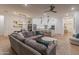 Bright and airy living space with an open layout, seamlessly connecting the living room, dining area, and kitchen at 11705 W Luxton Ln, Avondale, AZ 85323