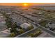 Scenic aerial view of a vibrant neighborhood, capturing the essence of community living and a beautiful sunset at 11705 W Luxton Ln, Avondale, AZ 85323
