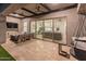This outdoor living space offers a relaxing seating area and view through to the home at 11705 W Luxton Ln, Avondale, AZ 85323