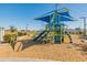 Vibrant community playground features a colorful play structure, slide, and ample space for children to enjoy outdoor recreation at 11705 W Luxton Ln, Avondale, AZ 85323