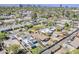 Panoramic aerial view of a residential area with lush greenery and a home featuring modern solar panels on the roof at 1422 E Windsor Ave, Phoenix, AZ 85006