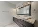 Elegant bathroom featuring dual sinks, contemporary lighting, and marble countertops at 1422 E Windsor Ave, Phoenix, AZ 85006