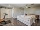 Bright bedroom features a ceiling fan, modern furniture, and wood-look flooring at 1422 E Windsor Ave, Phoenix, AZ 85006