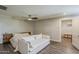 Bright bedroom features a ceiling fan, modern furniture, and wood-look flooring at 1422 E Windsor Ave, Phoenix, AZ 85006