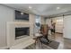 Bedroom featuring a fireplace, Peloton exercise bike, and barn doors to the closet at 1422 E Windsor Ave, Phoenix, AZ 85006