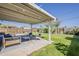Inviting covered patio with stylish outdoor seating, ideal for enjoying the serene backyard and beautiful weather at 1422 E Windsor Ave, Phoenix, AZ 85006