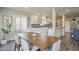 Open layout dining area next to a kitchen featuring light gray backsplash and stainless steel appliances at 1422 E Windsor Ave, Phoenix, AZ 85006