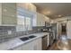 Modern kitchen features stainless steel appliances, gray backsplash, and ample counter space at 1422 E Windsor Ave, Phoenix, AZ 85006