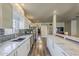 Modern kitchen featuring stainless steel appliances, white cabinets, and marble countertops at 1422 E Windsor Ave, Phoenix, AZ 85006
