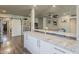 Open kitchen area with a marble countertop island connecting to the living room and a sliding barn door at 1422 E Windsor Ave, Phoenix, AZ 85006