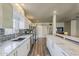 Modern kitchen featuring stainless steel appliances, white cabinets, and marble countertops at 1422 E Windsor Ave, Phoenix, AZ 85006