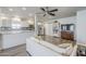 Bright open-concept living room featuring stylish white couch, kitchen view, and modern ceiling fan at 1422 E Windsor Ave, Phoenix, AZ 85006